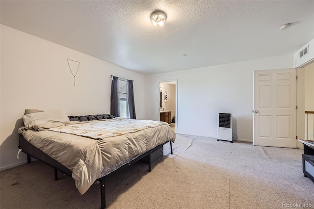 20530 Randolph Pl, Denver, CO 80249 - carpeted bedroom with a textured ceiling and ensuite bathroom