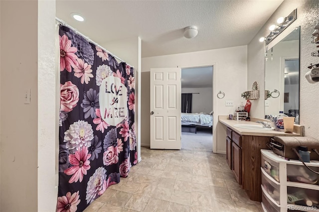 20530 Randolph Pl, Denver, CO 80249 - full bathroom with ensuite bathroom, vanity, curtained shower, and a textured ceiling