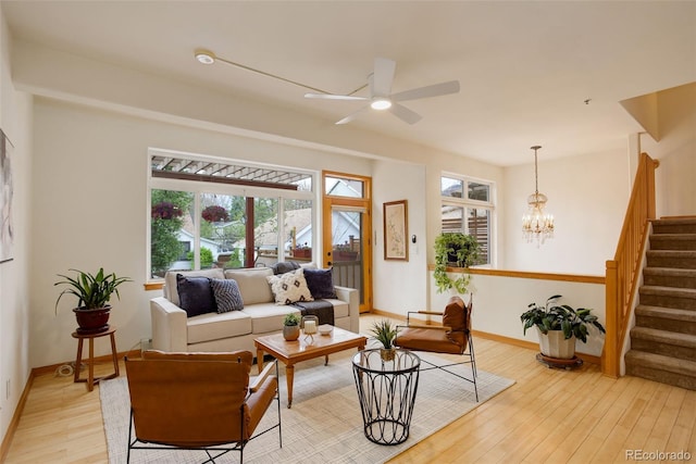 1460 Quince Ave Unit 102, Boulder, CO 80304 - living area with light wood-style floors, stairway, a ceiling fan, and a chandelier