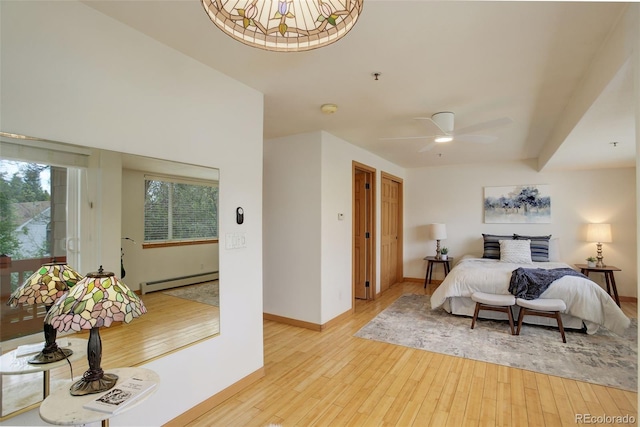 1460 Quince Ave Unit 102, Boulder, CO 80304 - bedroom with baseboard heating and light wood-style floors