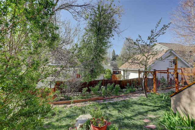 1460 Quince Ave Unit 102, Boulder, CO 80304 - fenced backyard featuring a garden and a garage