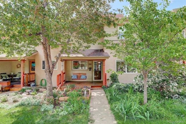 1460 Quince Ave Unit 102, Boulder, CO 80304 - view of front of home with stucco siding and a deck