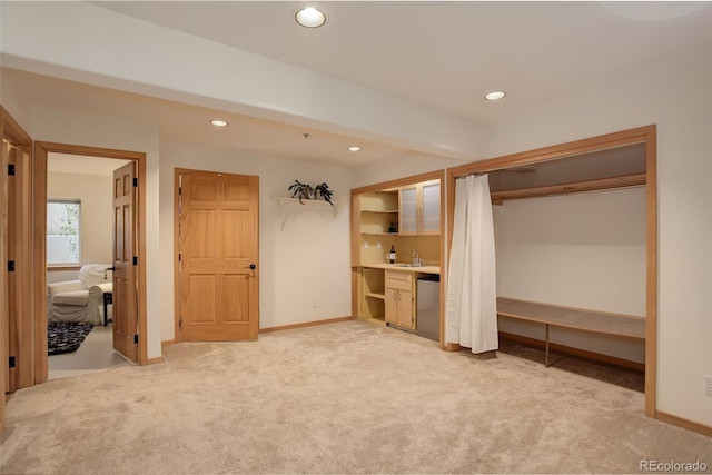 1460 Quince Ave Unit 102, Boulder, CO 80304 - unfurnished bedroom featuring light carpet, recessed lighting, built in study area, and multiple closets