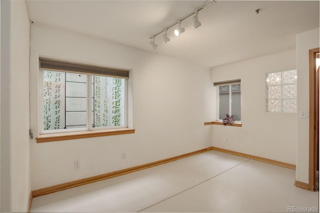 1460 Quince Ave Unit 102, Boulder, CO 80304 - empty room featuring track lighting and finished concrete floors