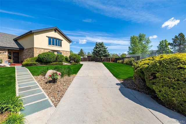 exterior space with a yard and fence