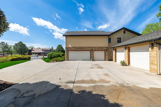 view of front of house featuring driveway and stucco siding