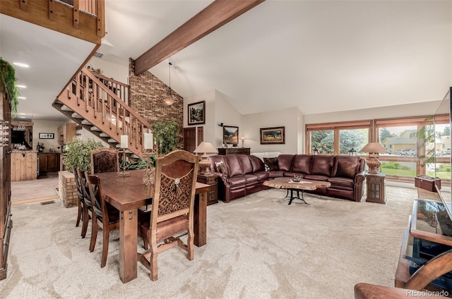 carpeted dining space with high vaulted ceiling, stairway, and beam ceiling