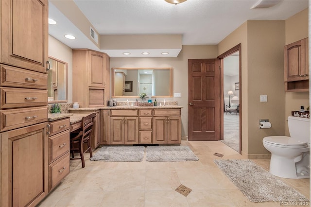 bathroom featuring recessed lighting, visible vents, vanity, and toilet