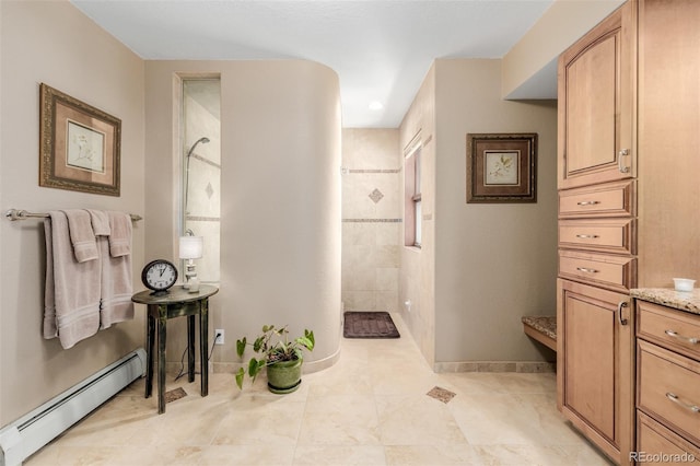 bathroom featuring baseboards, a baseboard heating unit, and walk in shower