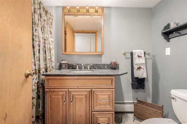 bathroom featuring toilet, tile patterned floors, a baseboard radiator, and vanity