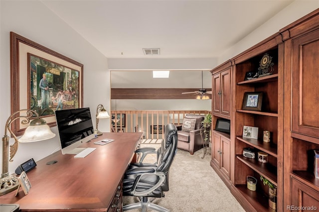 office with lofted ceiling, ceiling fan, visible vents, and light colored carpet