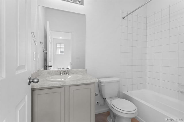 full bath featuring washtub / shower combination, vanity, and toilet