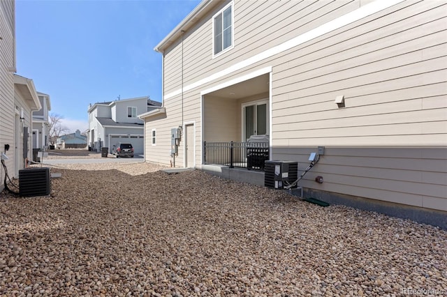 view of yard with a residential view and cooling unit