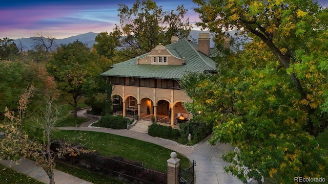 exterior space featuring a mountain view and a yard