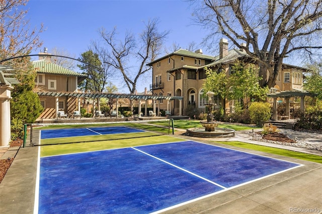 view of basketball court with a pergola and tennis court