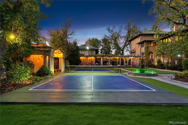 exterior space with a pergola and tennis court