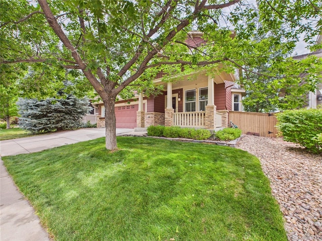 10497 Wagon Box Cir, Highlands Ranch, CO 80130 - view of front of house featuring a porch, driveway, a garage, and stone siding