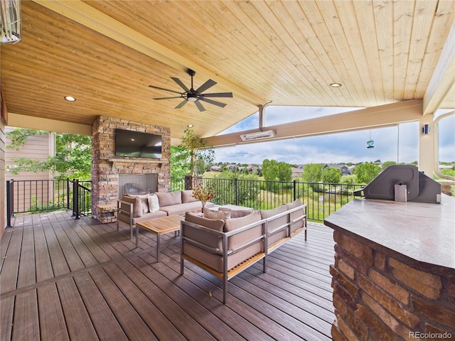 10497 Wagon Box Cir, Highlands Ranch, CO 80130 - deck with an outdoor living space with a fireplace and ceiling fan