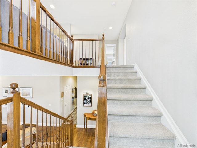 10497 Wagon Box Cir, Highlands Ranch, CO 80130 - stairs with wood finished floors and recessed lighting