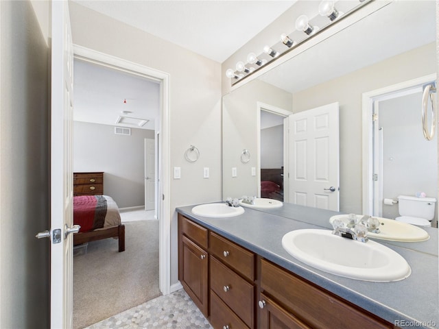10497 Wagon Box Cir, Highlands Ranch, CO 80130 - ensuite bathroom with double vanity and toilet