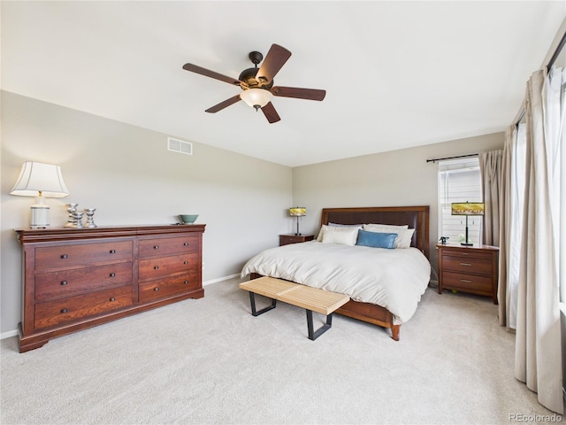 10497 Wagon Box Cir, Highlands Ranch, CO 80130 - bedroom with light colored carpet and a ceiling fan