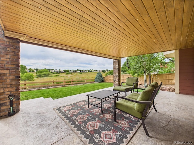 10497 Wagon Box Cir, Highlands Ranch, CO 80130 - fenced backyard featuring a patio area and an outdoor living space