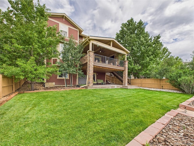 10497 Wagon Box Cir, Highlands Ranch, CO 80130 - back of property featuring ceiling fan, a fenced backyard, stairway, a wooden deck, and a patio area