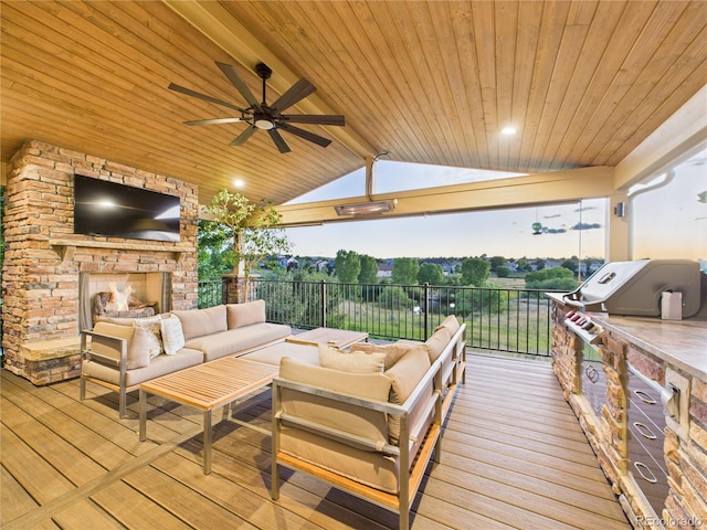 10497 Wagon Box Cir, Highlands Ranch, CO 80130 - wooden terrace featuring an outdoor living space with a fireplace and a ceiling fan