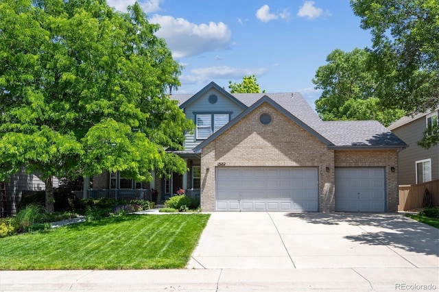 13132 Pennsylvania Cir, Thornton, CO 80241 - view of front of home with brick siding, an attached garage, concrete driveway, and a shingled roof
