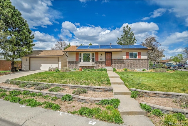 3451 Highland Pl, Westminster, CO 80031 - ranch-style home with roof mounted solar panels, an attached garage, a front lawn, and brick siding