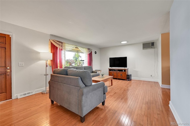 3451 Highland Pl, Westminster, CO 80031 - living area with visible vents, light wood-style floors, a wall mounted air conditioner, baseboards, and recessed lighting