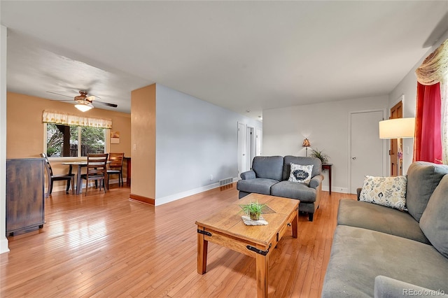 3451 Highland Pl, Westminster, CO 80031 - living area featuring a ceiling fan, baseboards, visible vents, and light wood-style flooring