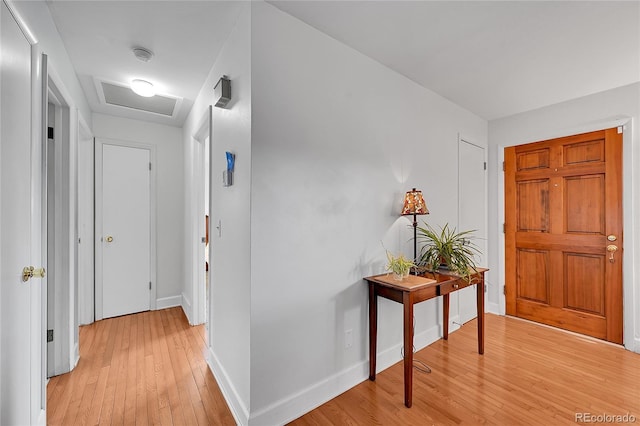 3451 Highland Pl, Westminster, CO 80031 - hallway with baseboards, attic access, and light wood-style flooring