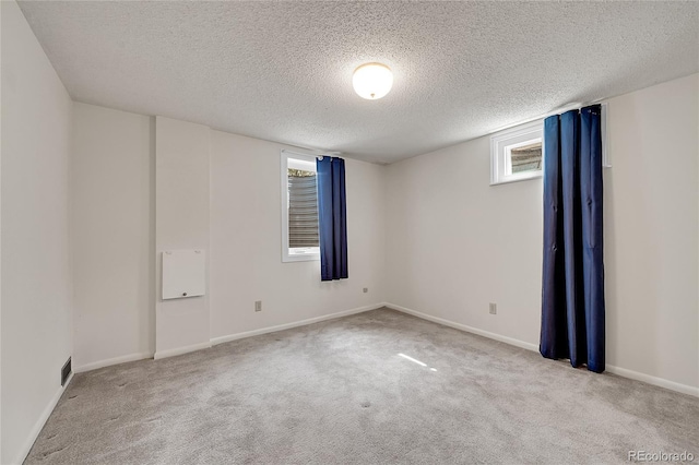 3451 Highland Pl, Westminster, CO 80031 - carpeted spare room with baseboards, a textured ceiling, and visible vents