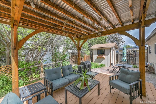 3451 Highland Pl, Westminster, CO 80031 - deck featuring a storage shed, outdoor lounge area, a fenced backyard, an outdoor structure, and a grill