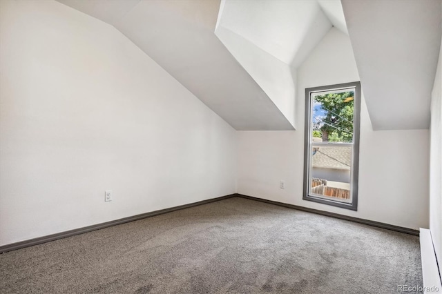 bonus room featuring carpet and vaulted ceiling