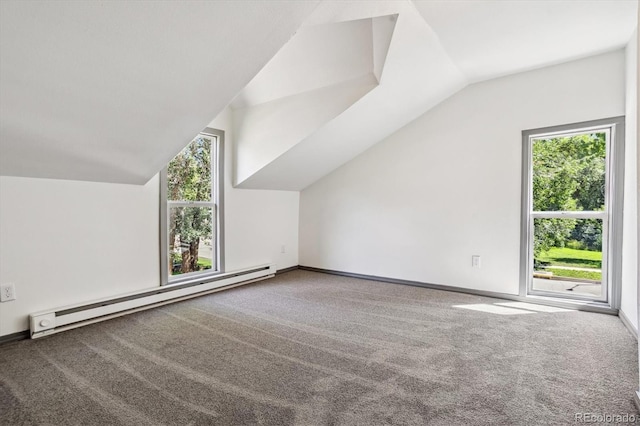 additional living space with a wealth of natural light, carpet flooring, lofted ceiling, and baseboard heating