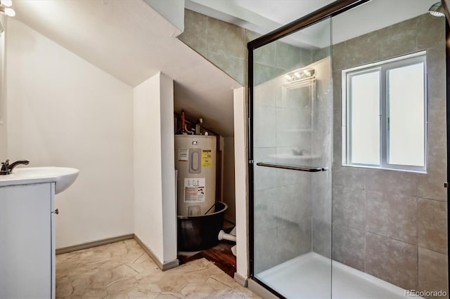 bathroom with a shower with shower door, water heater, vanity, and tile patterned floors