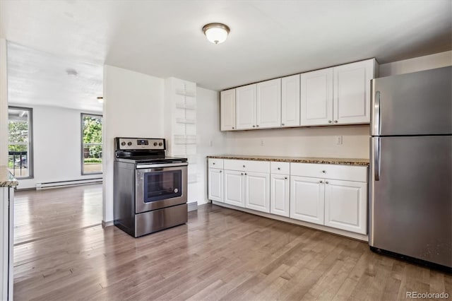 kitchen with white cabinets, light wood-type flooring, appliances with stainless steel finishes, and a baseboard radiator