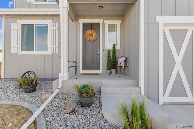 entrance to property featuring board and batten siding