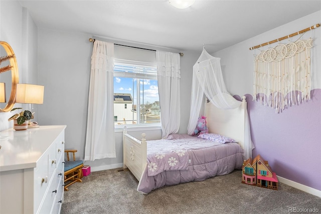 carpeted bedroom with baseboards