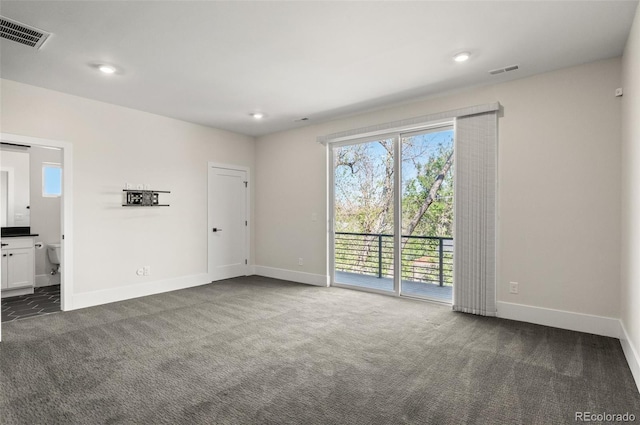 5240 N Raleigh St, Denver, CO 80212 - empty room with dark colored carpet, baseboards, and recessed lighting