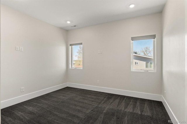 5240 N Raleigh St, Denver, CO 80212 - unfurnished room with dark carpet, healthy amount of natural light, baseboards, and recessed lighting