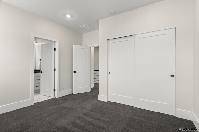 5240 N Raleigh St, Denver, CO 80212 - unfurnished bedroom with carpet floors, a closet, baseboards, and ensuite bathroom