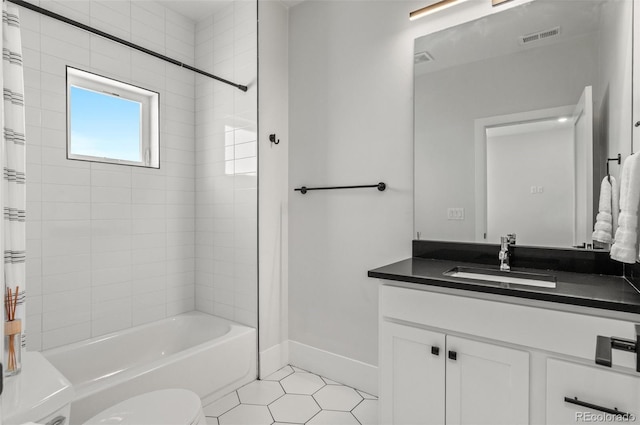 5240 N Raleigh St, Denver, CO 80212 - full bathroom with shower / tub combo, tile patterned floors, vanity, toilet, and baseboards