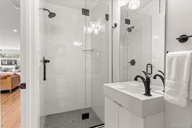 5240 N Raleigh St, Denver, CO 80212 - ensuite bathroom with a stall shower, wood finished floors, vanity, and recessed lighting