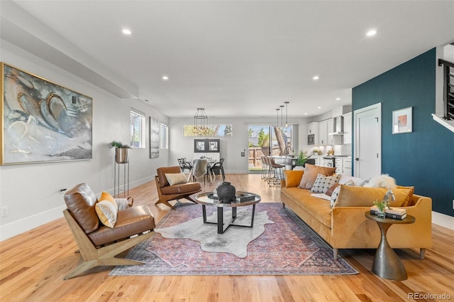5240 N Raleigh St, Denver, CO 80212 - living room featuring light wood-style floors, recessed lighting, and baseboards