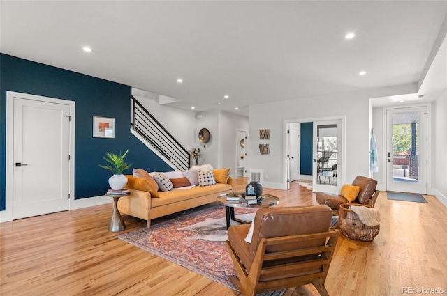 5240 N Raleigh St, Denver, CO 80212 - living area featuring light wood-style floors, stairs, recessed lighting, and baseboards