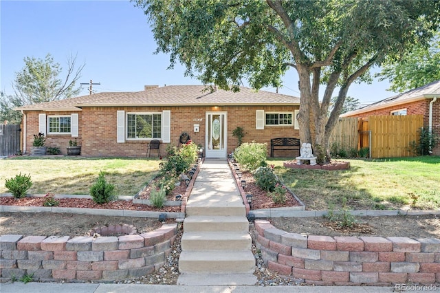 single story home with a front lawn