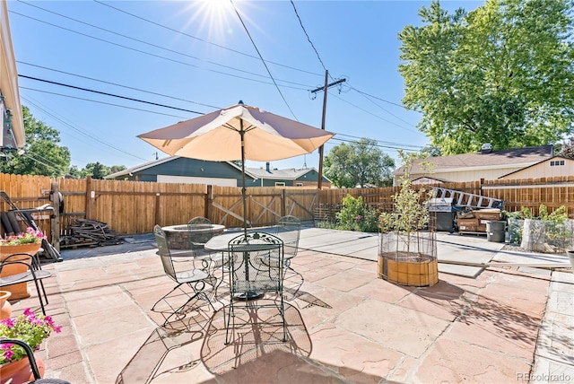 view of patio / terrace featuring a fire pit